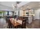 Bright and open living room has a dining area and kitchen with an island and modern decor at 3855 S Mcqueen Rd # 101, Chandler, AZ 85286