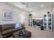 Bright living room featuring a comfortable sofa, entertainment center, and neutral decor at 3855 S Mcqueen Rd # 101, Chandler, AZ 85286