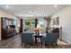 Comfortable living room featuring a piano, stylish furnishings, hardwood floors and lots of natural light at 3855 S Mcqueen Rd # 101, Chandler, AZ 85286