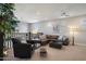 This loft has seating, a comfortable sectional, a ceiling fan and lots of natural light at 3855 S Mcqueen Rd # 101, Chandler, AZ 85286