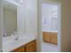 Bright bathroom with white countertops, light cabinets, and a view into a second connected bathroom at 3928 N 151St Ave, Goodyear, AZ 85395