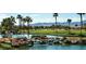 Picturesque community with a pond, waterfall feature, and golf course views at 3928 N 151St Ave, Goodyear, AZ 85395
