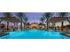 Beautiful community pool with poolside cabanas, lush palm trees, and a clubhouse create a resort-like atmosphere at 3928 N 151St Ave, Goodyear, AZ 85395