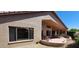 Exterior of house showing covered patio and neat desert landscaping at 3928 N 151St Ave, Goodyear, AZ 85395