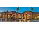 An attractive building with multiple arched windows and stucco exterior surrounded by palm trees at 3928 N 151St Ave, Goodyear, AZ 85395