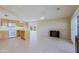 Bright kitchen featuring tile floors, light wood cabinets, and a center island, open to the living area at 3928 N 151St Ave, Goodyear, AZ 85395