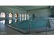 Indoor lap pool featuring lane markers, handrails, and plenty of natural light at 3928 N 151St Ave, Goodyear, AZ 85395