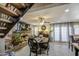 Charming dining room features a fireplace, wooden staircase, and abundant natural light at 4112 E Maldonado Dr, Phoenix, AZ 85042