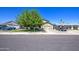 Charming single-story home featuring a well-manicured lawn and mature shade tree in a quiet neighborhood setting at 4112 E Maldonado Dr, Phoenix, AZ 85042
