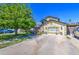 Attractive home with a manicured front yard, featuring lush landscaping, mature trees, and a spacious driveway at 4112 E Maldonado Dr, Phoenix, AZ 85042