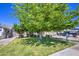 Charming home with a mature tree providing shade, complemented by a well-maintained lawn and manicured landscaping at 4112 E Maldonado Dr, Phoenix, AZ 85042