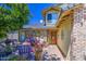 Inviting front entryway with decorative brickwork, lush plants, and comfortable seating, creating a welcoming ambiance at 4112 E Maldonado Dr, Phoenix, AZ 85042