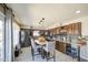 Eat-in kitchen featuring stainless steel appliances, a large island, and custom cabinetry at 4112 E Maldonado Dr, Phoenix, AZ 85042