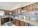 Well-appointed kitchen with granite countertops, stainless steel appliances, and ample cabinet space at 4112 E Maldonado Dr, Phoenix, AZ 85042