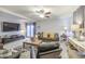 Inviting living room featuring comfortable furniture, soft lighting, and a decorative rug at 4112 E Maldonado Dr, Phoenix, AZ 85042