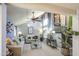 Spacious living room with vaulted ceilings, staircase access, modern decor, and ample natural light at 4112 E Maldonado Dr, Phoenix, AZ 85042