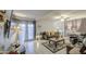 Cozy living room featuring neutral decor, tile flooring, ceiling fan, and comfortable seating arrangement at 4112 E Maldonado Dr, Phoenix, AZ 85042