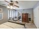 Spacious main bedroom with a king bed, natural light, and view to ensuite bath at 4112 E Maldonado Dr, Phoenix, AZ 85042