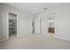 Spacious carpeted bedroom with a walk-in closet, ensuite access, and neutral color palette at 4320 E Bernice St, Gilbert, AZ 85295