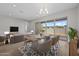 Dining room with wood floors, modern chandelier, furniture and large sliding glass doors at 4320 E Bernice St, Gilbert, AZ 85295