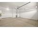 An empty two car garage with sealed concrete flooring and plenty of space for storage and vehicles at 4320 E Bernice St, Gilbert, AZ 85295