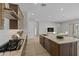 Bright, modern kitchen featuring an island with granite countertops and stainless steel appliances at 4320 E Bernice St, Gilbert, AZ 85295