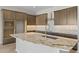 Kitchen island with granite countertops, stainless steel appliances, and ample cabinet space at 4320 E Bernice St, Gilbert, AZ 85295
