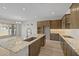Spacious kitchen island with granite countertops, cabinets, and stainless steel appliances at 4320 E Bernice St, Gilbert, AZ 85295