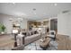 Modern living area with stylish furniture, open to kitchen and dining areas with hardwood floors at 4320 E Bernice St, Gilbert, AZ 85295