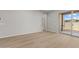 Spacious living room with wood-look floors and sliding doors leading to the outdoors at 4320 E Bernice St, Gilbert, AZ 85295