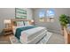 Stylishly furnished main bedroom with a bed, side tables, lamps, and artwork creating a relaxing atmosphere at 4320 E Bernice St, Gilbert, AZ 85295