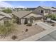 Aerial view of a single-story home with a two-car garage, desert landscaping, and tiled roof at 44284 W Buckhorn Trl, Maricopa, AZ 85138