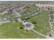 Community aerial view showing community park with playground and trees at 44284 W Buckhorn Trl, Maricopa, AZ 85138