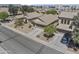 Aerial view of homes with desert landscaping, tiled roofs, and two-car garages in a community at 44284 W Buckhorn Trl, Maricopa, AZ 85138
