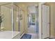 This bathroom includes a shower and a doorway to another room at 44284 W Buckhorn Trl, Maricopa, AZ 85138