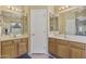 This bathroom includes double sinks with a door in between them at 44284 W Buckhorn Trl, Maricopa, AZ 85138