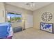 This bedroom features a window and a view of the outside at 44284 W Buckhorn Trl, Maricopa, AZ 85138