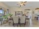 Comfortable dining area features a dining table with chairs and views of the outside at 44284 W Buckhorn Trl, Maricopa, AZ 85138