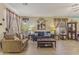 Inviting living room featuring neutral tones, stylish furnishings, and bright, natural lighting at 44284 W Buckhorn Trl, Maricopa, AZ 85138
