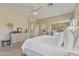 This main bedroom features a ceiling fan, closet, and a full dresser at 44284 W Buckhorn Trl, Maricopa, AZ 85138