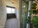 Cozy balcony with textured walls and a sliding glass door to the indoors at 461 W Holmes Ave # 336, Mesa, AZ 85210