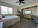 Bedroom features a bed, dressers, ceiling fan, and closet at 461 W Holmes Ave # 336, Mesa, AZ 85210