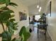 Bright dining area featuring a modern glass table and metal chairs at 461 W Holmes Ave # 336, Mesa, AZ 85210