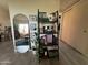 Bright hallway featuring a large mirror, shelving unit, and closet with sliding doors at 461 W Holmes Ave # 336, Mesa, AZ 85210