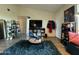 A sun-filled living room featuring modern decor, a teal rug and nice plants at 461 W Holmes Ave # 336, Mesa, AZ 85210