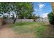 This spacious backyard features lush grass, two sheds, and block wall fencing at 4744 W Altadena Ave, Glendale, AZ 85304