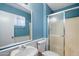 Well-lit bathroom featuring shower with glass door, tile floors and walls at 4744 W Altadena Ave, Glendale, AZ 85304