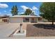 Charming single-story home featuring a spacious front yard with mature trees and a two-car garage at 4744 W Altadena Ave, Glendale, AZ 85304