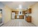 Bright kitchen featuring tile floors, white appliances and views to the backyard at 4744 W Altadena Ave, Glendale, AZ 85304