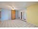 Spacious room with tile flooring, light blue walls, and direct access to the backyard at 4744 W Altadena Ave, Glendale, AZ 85304